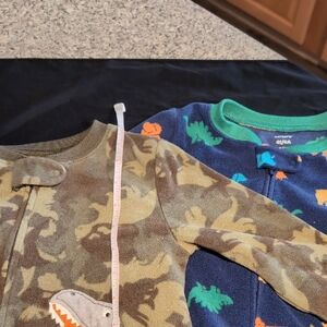 Carter's Camouflage And Blue  Dinosaur Footie Pajama Sets Sold Together.